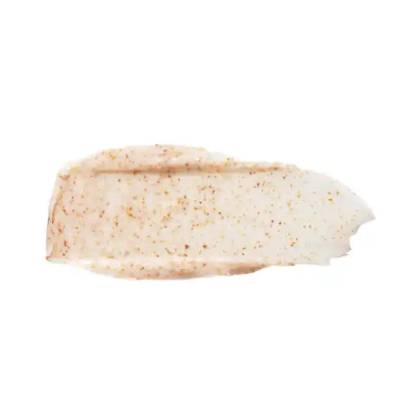 Smeared beige cosmetic product with subtle shimmer particles.