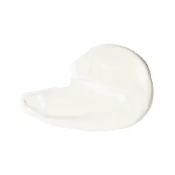 White cream or lotion smear with a curved teardrop shape.