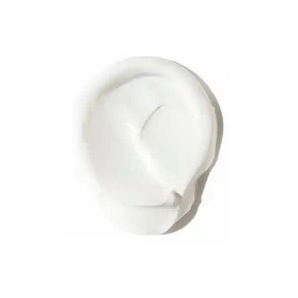 White, creamy moisturizer or lotion swirled into a circular shape.