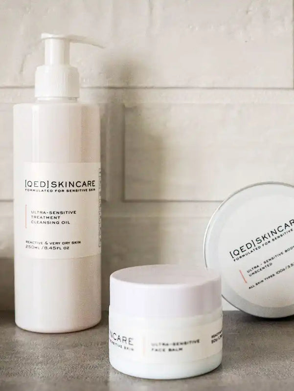 White skincare products from the brand ’iocdi skincare’ including a pump bottle and jar.